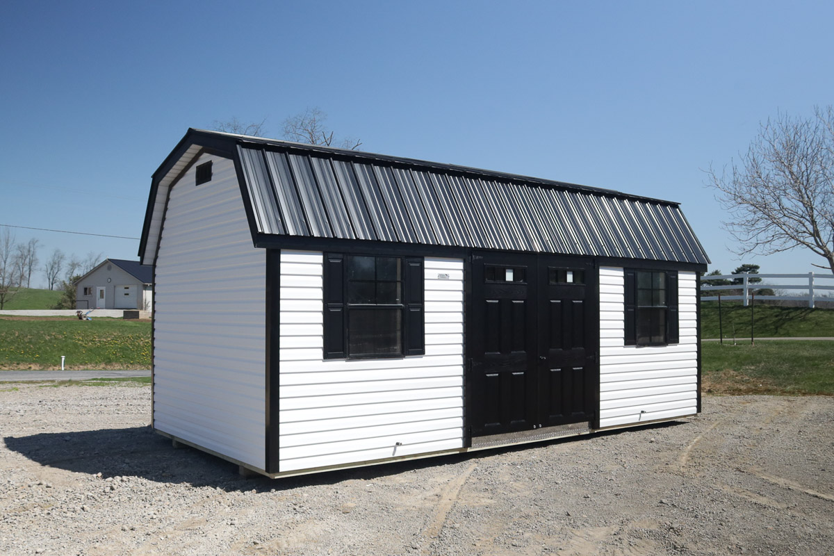 White lofted barn with black double barn doors