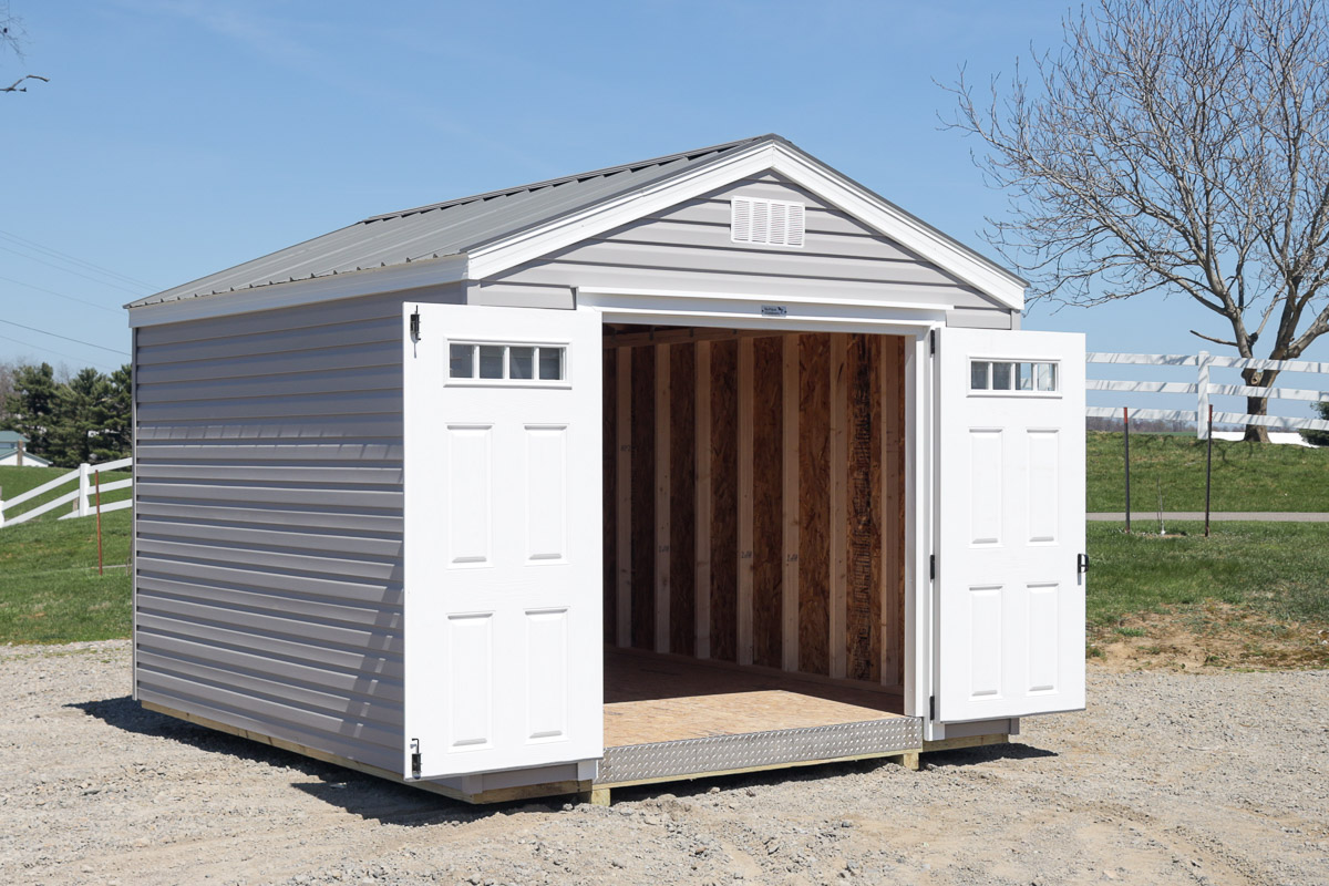 Silver storage shed with doors open showing interior